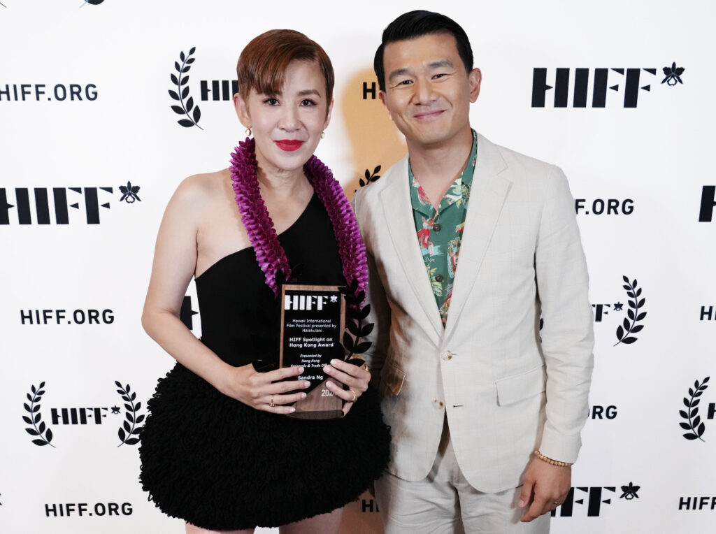 Ronny Chieng presented the Hong Kong Filmmaker in Profile Award to Sandra Ng